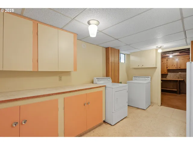 a kitchen with appliances cabinets and a sink