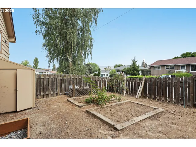 a view of a wooden fence