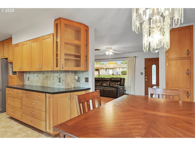 a kitchen with stainless steel appliances granite countertop a sink and cabinets
