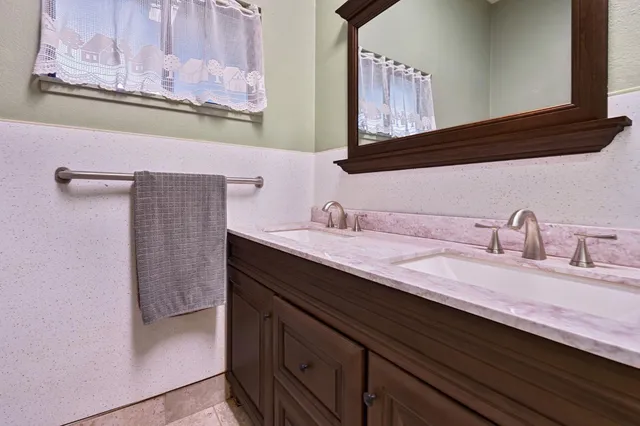 a bedroom with a bed and cabinets