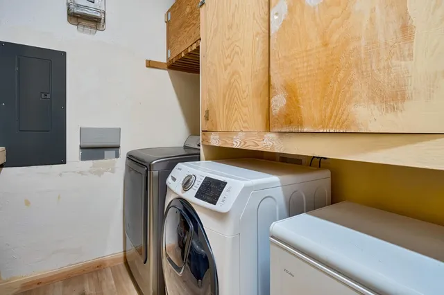 a view of a field with trees in the background
