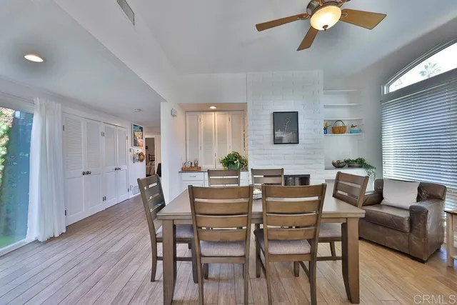 a dining room with furniture and wooden floor