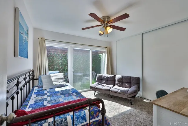 a view of a hallway with wooden floor and potted plants