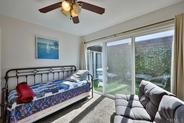 a view of a backyard with chair and table