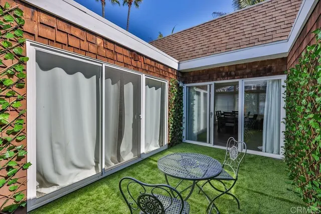 a table and chairs in a garden