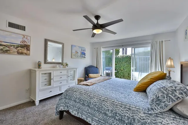 a spacious bathroom with a double vanity sink and mirror