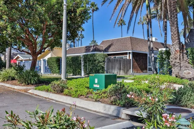 a view of a room with wooden walls and windows