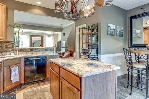 a kitchen with a stove center island and furniture