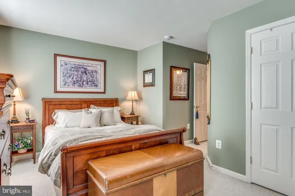 a bedroom with a bed and furniture