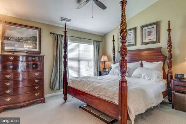 a bed room with a bed and a window