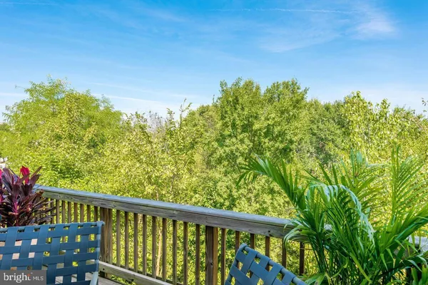a view of outdoor space with deck and furniture