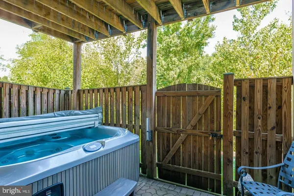 a view of a porch with wooden floor