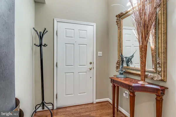 a view of a hallway with entryway door