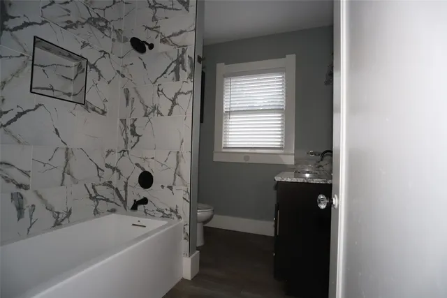 a bathroom with a bathtub and a shower