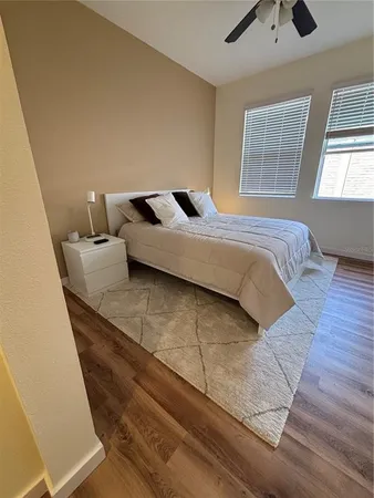a bedroom with a bed and window