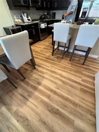 a living room with furniture and a rug