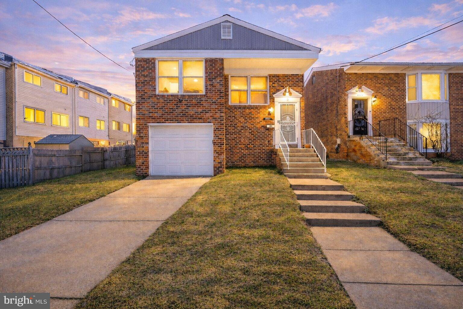 Charming brick home at twilight glow.