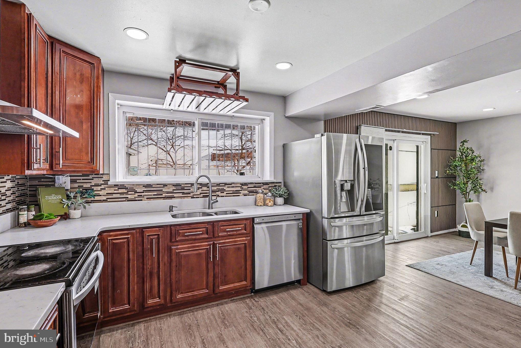 2402 24th Street Southeast Washington, DC 20020 - Photo 5 of 41 Modern kitchen with elegant wood accents.