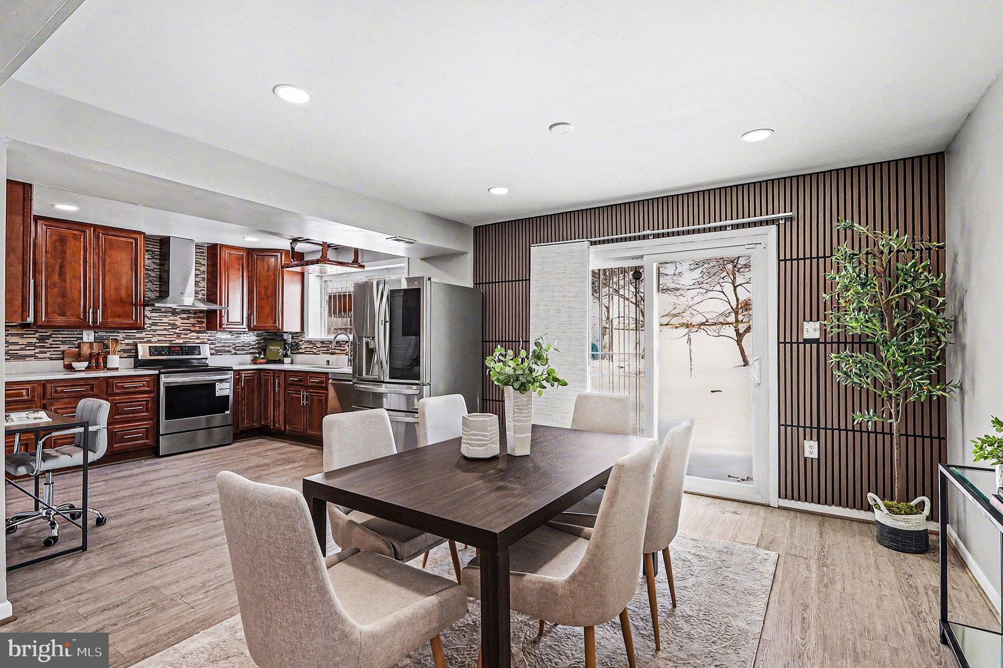 2402 24th Street Southeast Washington, DC 20020 - Photo 8 of 41 Modern kitchen with elegant dining space.