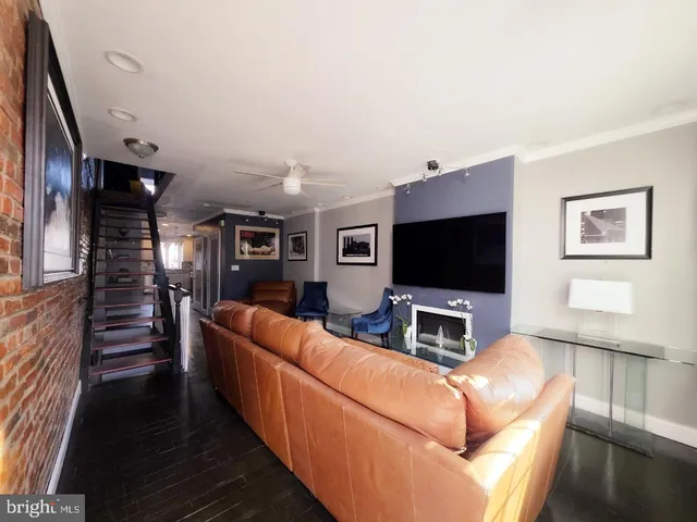 a couple of cars parked in front of a building