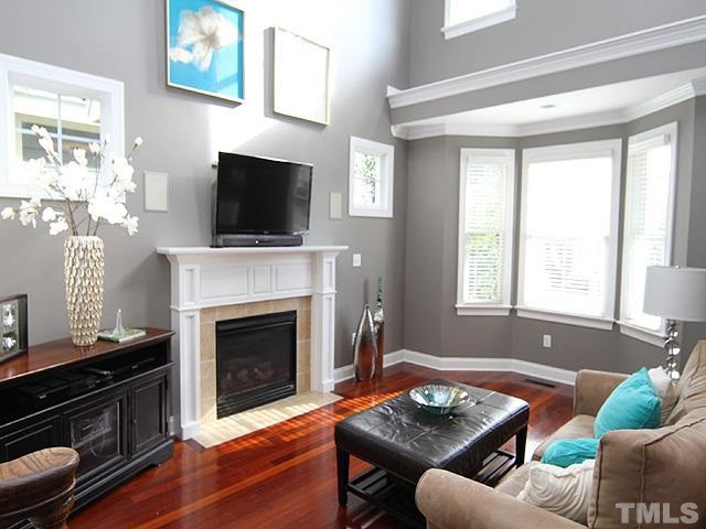 2225 Karns Place Raleigh, NC 27614 - Photo 23 of 23 Beautiful gas log fireplace, gorgeous floors, ceiling fan, natural light, plenty of windows for natural light, spacious and flowing floor plan. Great for entertaining. Den/Family/Great Room