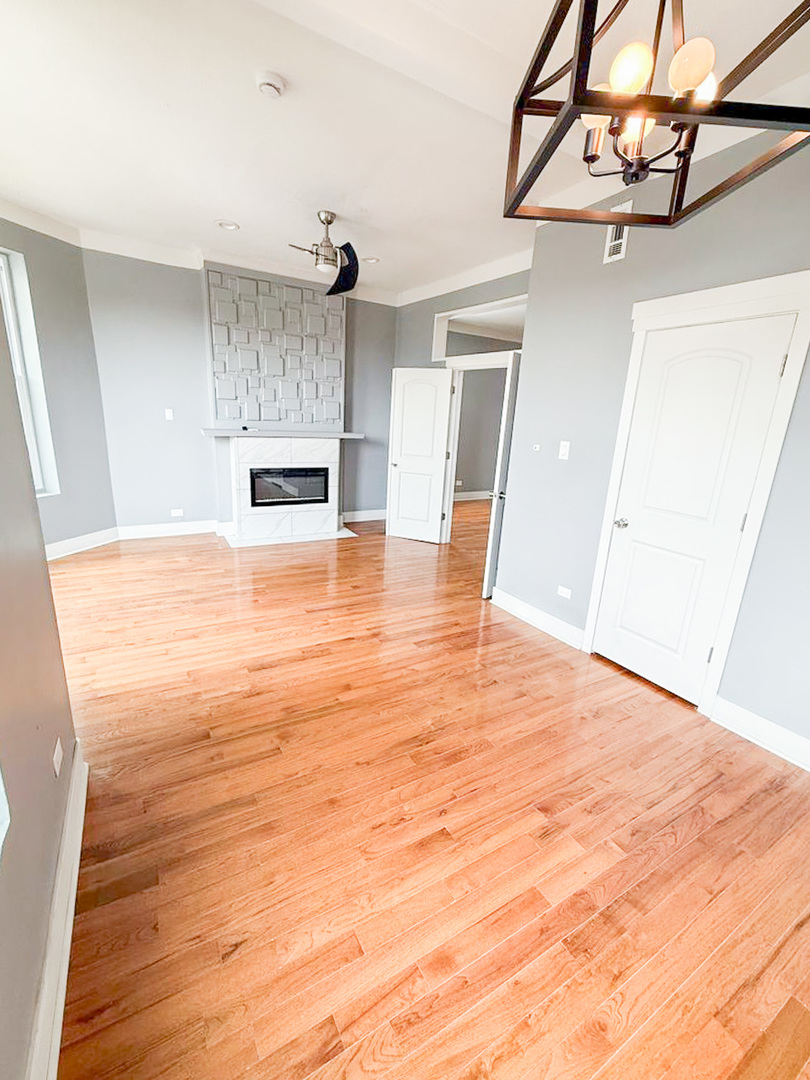 438 East 49th Street, Unit 3 Chicago, IL 60615 - Photo 3 of 18 a view of empty room with wooden floor