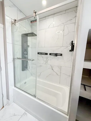 a bathroom with a bath tub