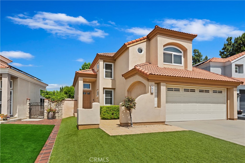 7432 Holloway Road Rancho Cucamonga, CA 91730 - Photo 1 of 1 a front view of a house with a yard