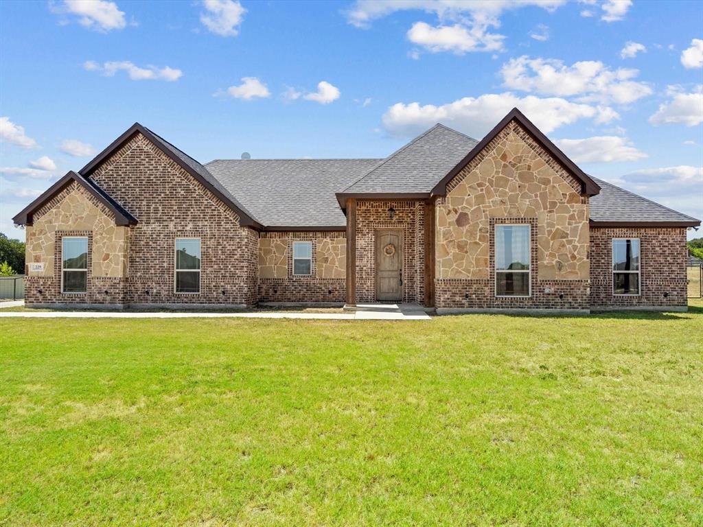 229 Etta Lane Springtown, TX 76082 - Photo 1 of 39 a view of an house with backyard and swimming pool
