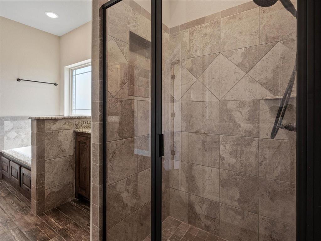 229 Etta Lane Springtown, TX 76082 - Photo 26 of 39 a bathroom with a shower and a sink