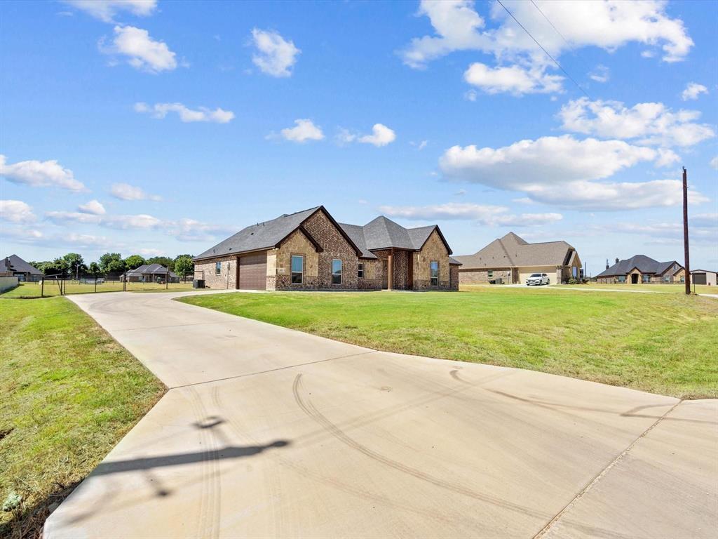 229 Etta Lane Springtown, TX 76082 - Photo 3 of 39 a view of a house with a big yard