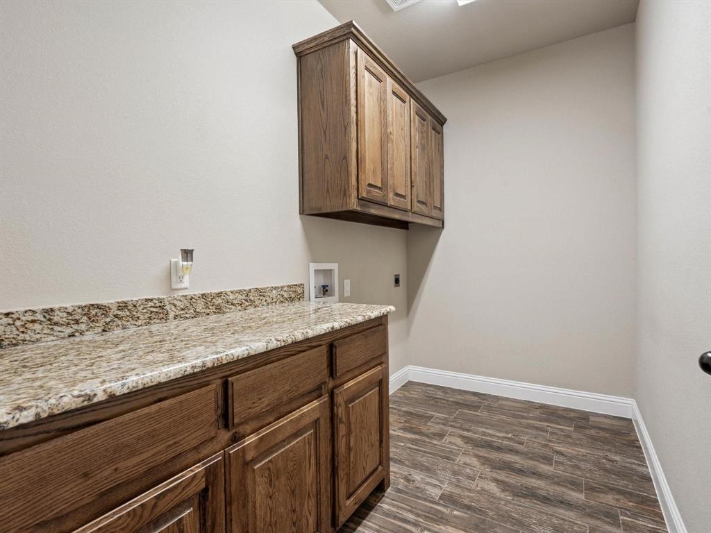 229 Etta Lane Springtown, TX 76082 - Photo 33 of 39 a view of cabinets and wooden floor