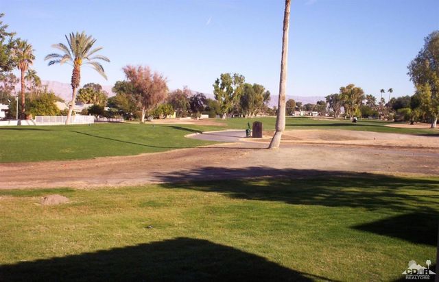 a view of an ocean and trees