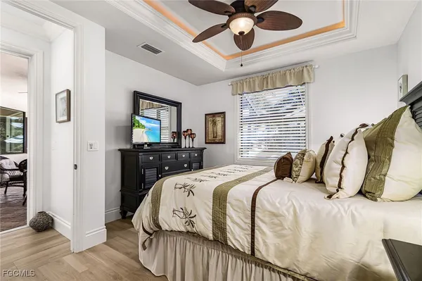 a view of a dining room with furniture clock and a large window