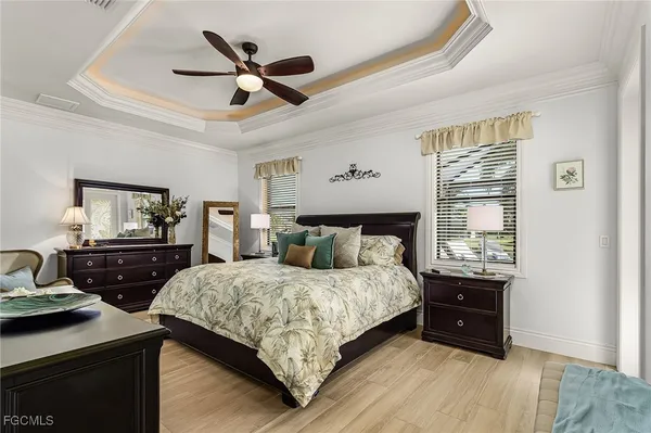 a large white kitchen with stainless steel appliances