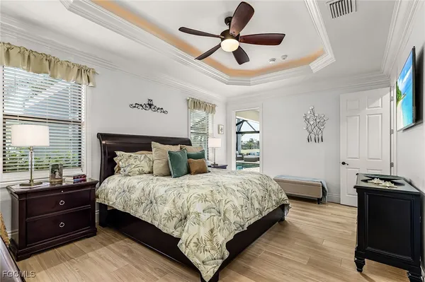 a kitchen with granite countertop a refrigerator and cabinets