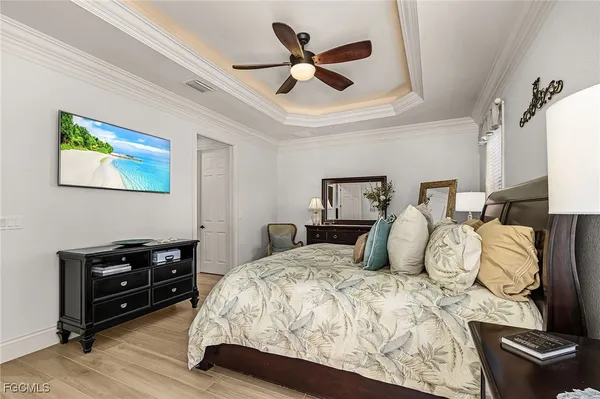 a kitchen with stainless steel appliances granite countertop a stove a sink and white cabinets