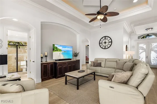 a view of a swimming pool with a patio and plants