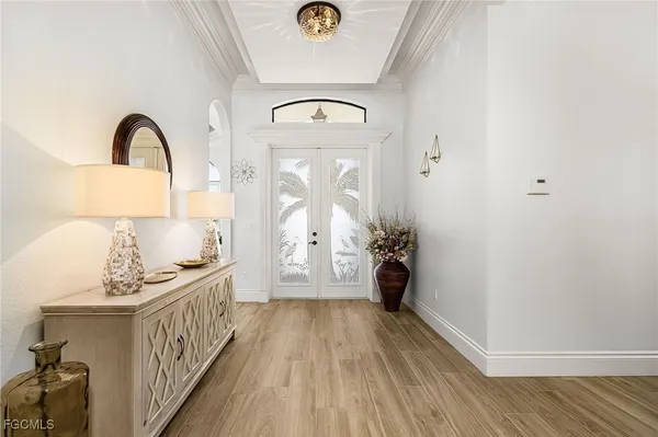 a large bed sitting in a bedroom next to a window