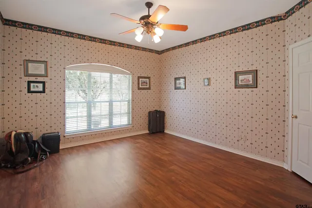 a view of livingroom with hardwood floor and a ceiling fan