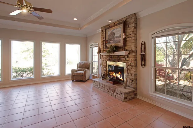 a living room with furniture a window and a fireplace