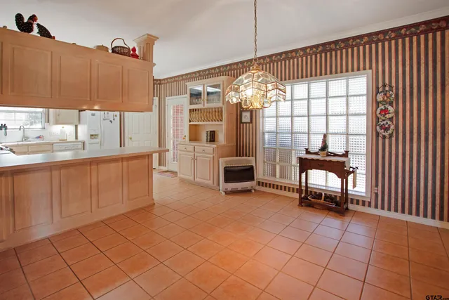 a view of a livingroom with furniture and a window