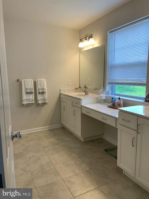 30 South Tompkins Square Downingtown, PA 19335 - Photo 18 of 33 a bathroom with a sink vanity and mirror