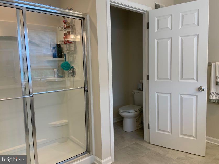 30 South Tompkins Square Downingtown, PA 19335 - Photo 19 of 33 a bathroom with a granite countertop shower and a toilet