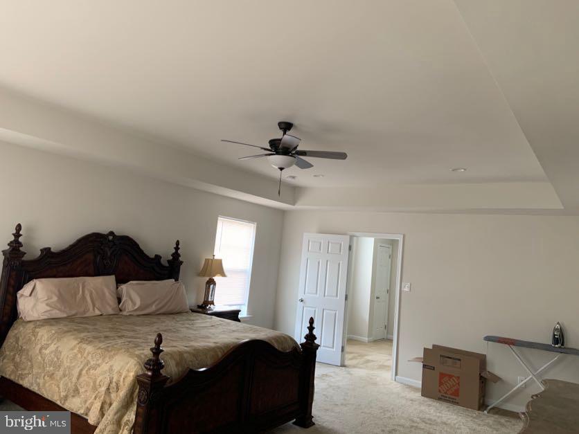 30 South Tompkins Square Downingtown, PA 19335 - Photo 20 of 33 a bedroom with a bed and a chandelier