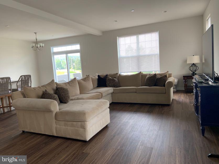 30 South Tompkins Square Downingtown, PA 19335 - Photo 5 of 33 a living room with furniture and a flat screen tv