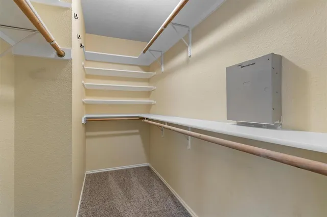 a spacious bathroom with a bathtub sink and mirror