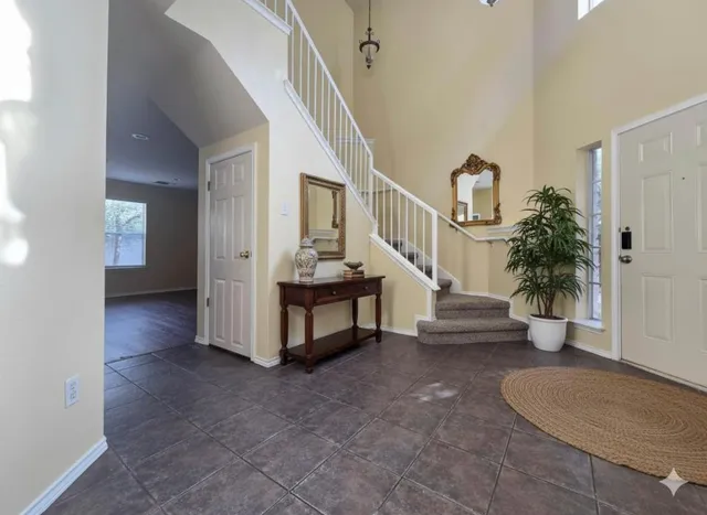 a view of entryway with livingroom and stairs