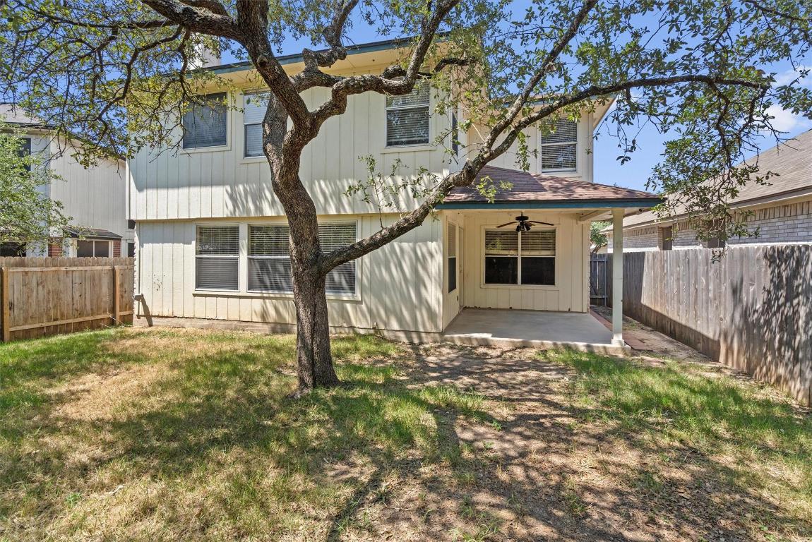 8336 Alvin High Lane Austin, TX 78729 - Photo 36 of 40 Rear view of house featuring a patio area, a ceiling fan, a fenced backyard, and board and batten siding