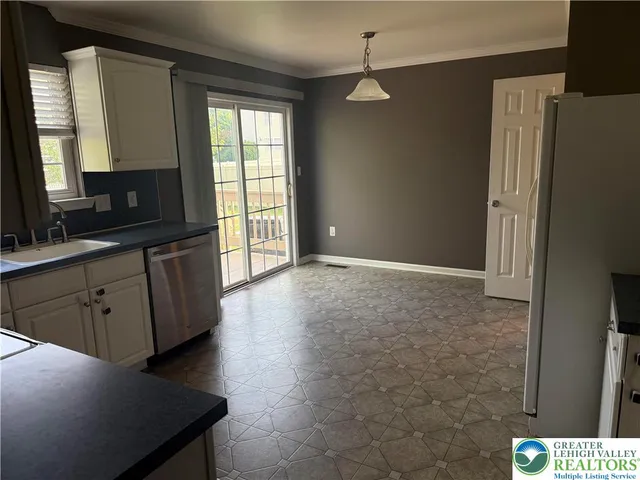 a view of a kitchen cabinets and wooden floor